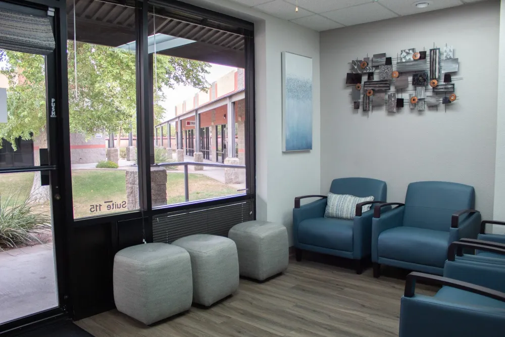 Waiting room seating with teal armchairs