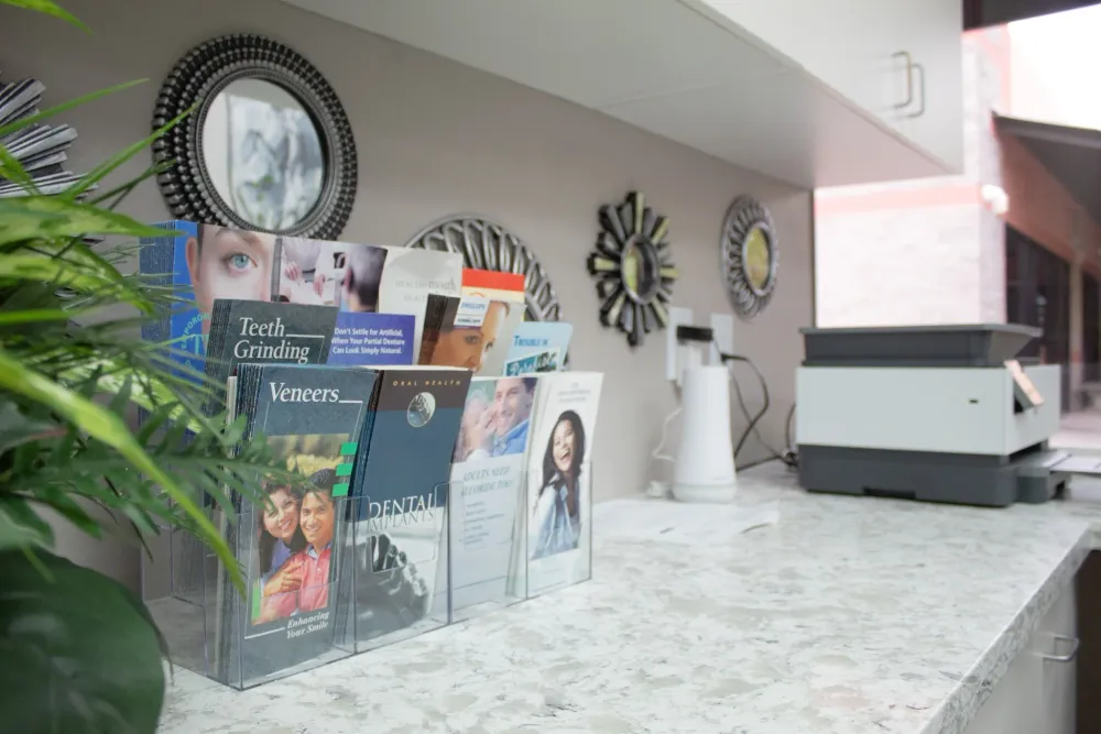 Dental care brochures on a marble counter